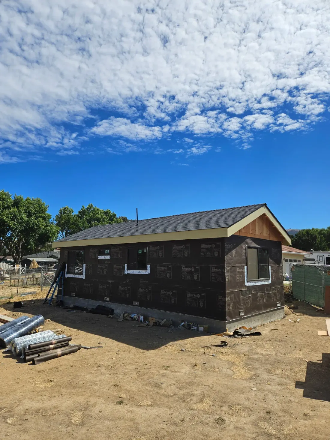 A Bayfront ADU roofed and wrapped in weather barrier, ready for stucco